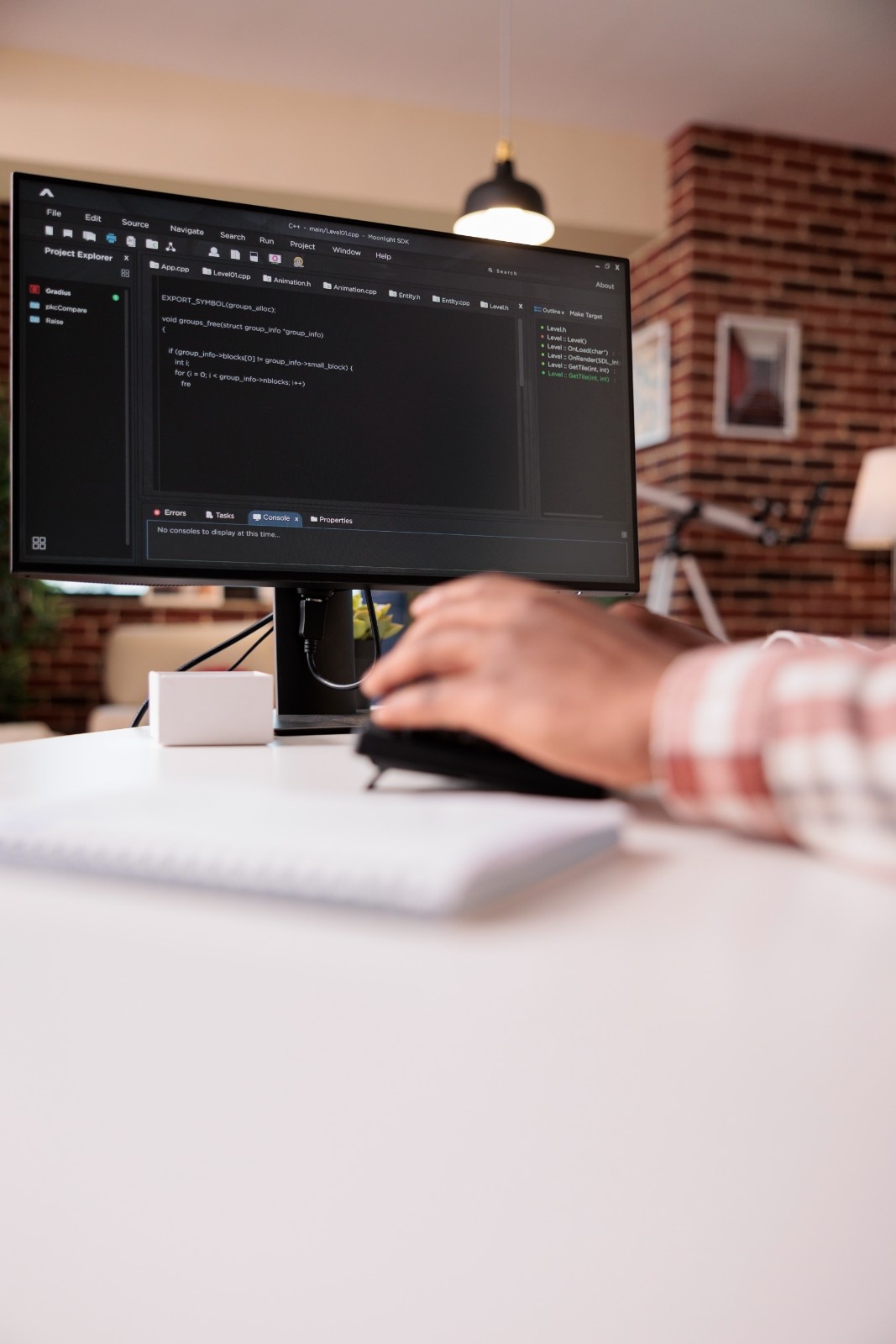 Web Developer coding on computer with IDE